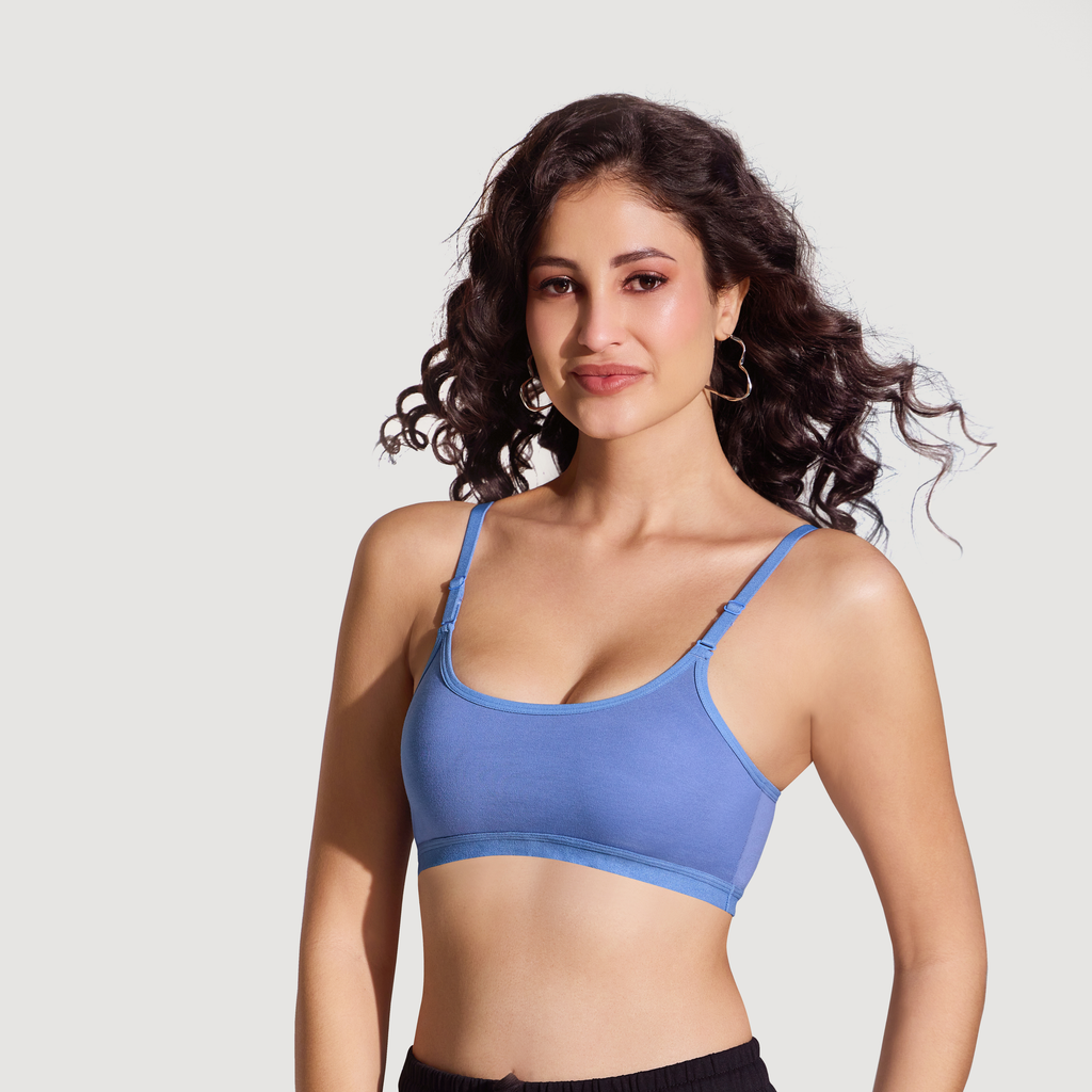 Model wearing Kurvz Force blue non-padded bra with adjustable straps and soft everyday support.